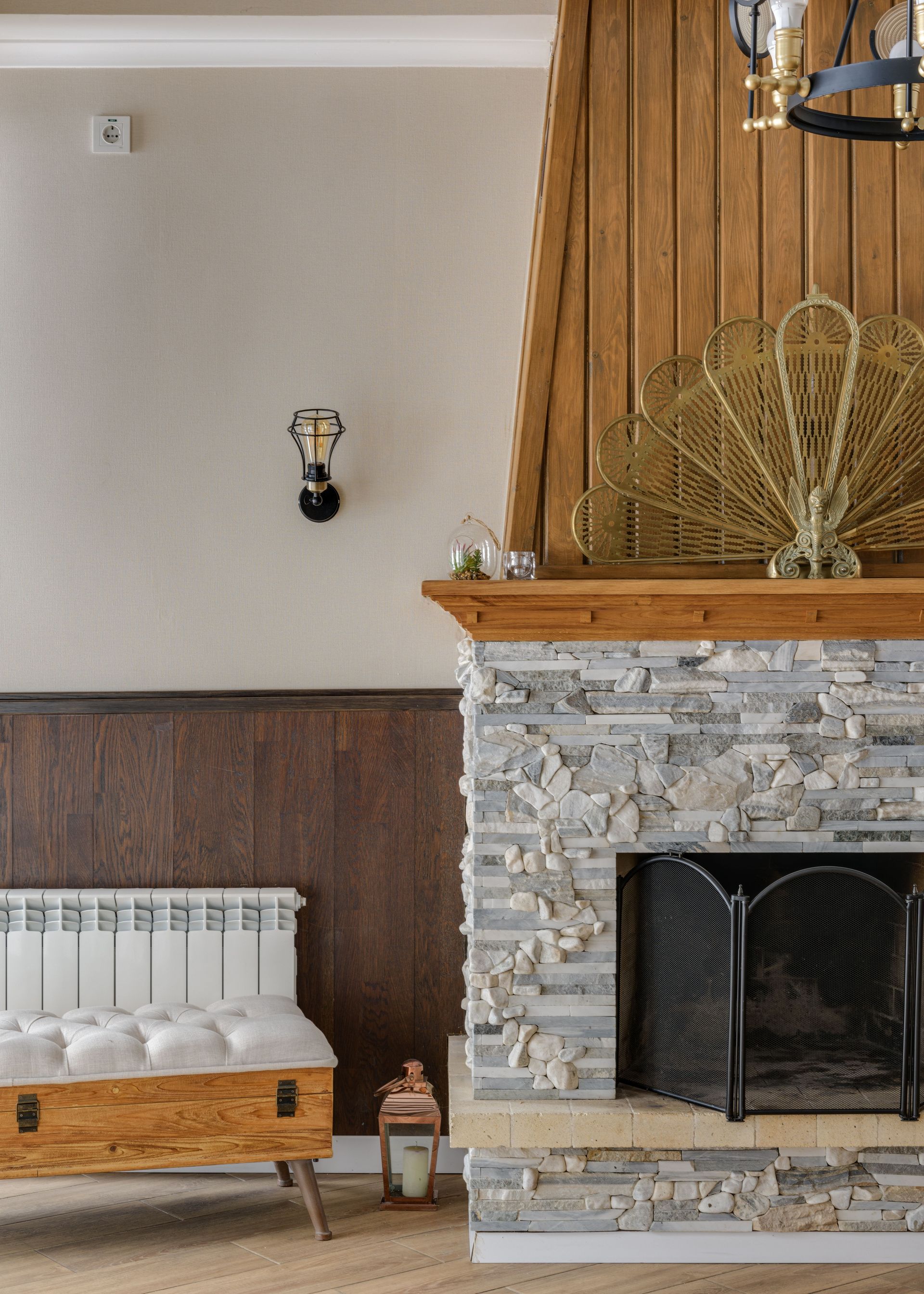 Warm and inviting living room featuring a stone fireplace and elegant interior design elements.